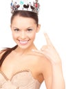 Woman in crown showing devil horns gesture Royalty Free Stock Photo