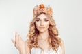 Woman with the crown shows come here gestures with her index finger right hand, white background. Woman wearing crown, bride Royalty Free Stock Photo