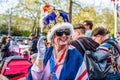 Woman with a crown and union jack waiting for King Charles III coronation