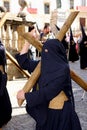 Woman & crucifix, Easter procession in Spain Royalty Free Stock Photo