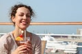 Woman on cruise liner with cocktail Royalty Free Stock Photo