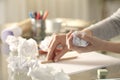 Woman crumpling piece of paper leaving pencil on desk