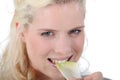 Woman crunching a leaf of endive Royalty Free Stock Photo