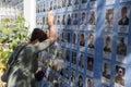 Woman cry next to Memory Wall of the Fallen Defenders of Ukraine in the war in Eastern Ukraine 2014-2020. Kyiv, Ukraine