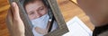 Woman crying over portrait of deceased young man closeup