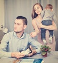 Woman with crying son extorting money Royalty Free Stock Photo