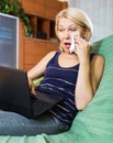 Woman crying while using laptop Royalty Free Stock Photo