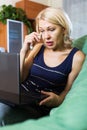 Woman crying while using laptop Royalty Free Stock Photo