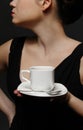 Woman with a cup of black coffee