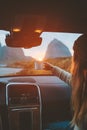 Woman with cup in car on road trip traveling relaxing drinking coffee Royalty Free Stock Photo