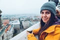 Woman with cup of coffe looking at european city Royalty Free Stock Photo