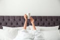 Woman with cup of coffee in bed. Lazy morning Royalty Free Stock Photo