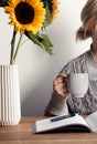 Happy morning with coffee and sunflowers in the home office Royalty Free Stock Photo