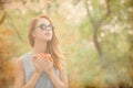 Woman with cup of coffee on the wonderful autumn park Royalty Free Stock Photo