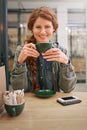 Woman, cup and happy in coffee shop for portrait at breakfast to start morning at table. Girl, person and smile in Royalty Free Stock Photo