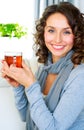 Woman with cup of hot tea