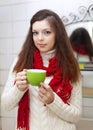 Woman with cup of medicine gargling