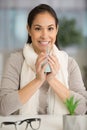 woman cupping hot drink in hands Royalty Free Stock Photo