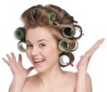 Woman curling her hair with roller Royalty Free Stock Photo