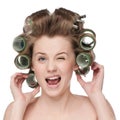 Woman curling her hair with roller Royalty Free Stock Photo