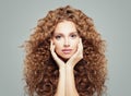 Woman with curly hair. Beautiful girl with healthy wavy hairstyle, haircare concept