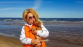 A woman with curly hair on a walk with a dog Royalty Free Stock Photo