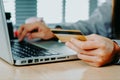 Woman customer hands holding credit card and using laptop for online shopping Royalty Free Stock Photo