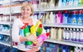 Woman customer holding chemical goods for cleaning