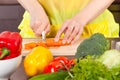 Woman cut carrot Royalty Free Stock Photo