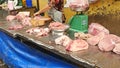 Woman cut up raw meat on a Saigon street. Royalty Free Stock Photo