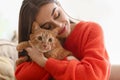 Woman with cute cat resting at home Royalty Free Stock Photo