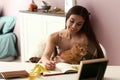 Woman with cute cat resting at home on autumn day Royalty Free Stock Photo