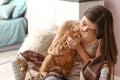 Woman with cute cat resting at home Royalty Free Stock Photo