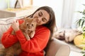 Woman with cute cat resting at home Royalty Free Stock Photo