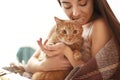 Woman with cute cat resting at home Royalty Free Stock Photo