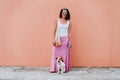 Woman cute dog woman walking by the city, holding a cotton bag with fruit. Eco friendly, zero waste concept Royalty Free Stock Photo