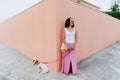 Woman cute dog woman walking by the city, holding a cotton bag with fruit. Eco friendly, zero waste concept Royalty Free Stock Photo