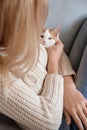 Woman with cute little kitten resting at home Royalty Free Stock Photo