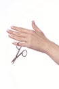Woman cuts nails scissors, close up