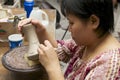 Woman cuts traditional tattoo motives decoration at kaolin, Kuching, Malaysia