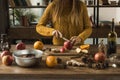 Woman cutting apples for mulled wine Royalty Free Stock Photo