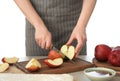 Woman cutting apples for pastry on wooden board Royalty Free Stock Photo