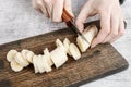 Woman cutting banana fruit