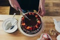 Woman cutting chocolate cake Royalty Free Stock Photo