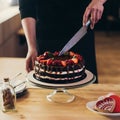 Woman cutting chocolate cake Royalty Free Stock Photo