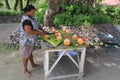 Woman cutting a coconut