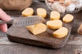 Woman cutting dough with a knife on the kitchen table. Concept of cooking dough, cookies, pizza Royalty Free Stock Photo