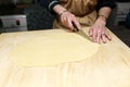 Woman cutting dough into strips for cooking chak-chak Royalty Free Stock Photo