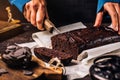 Woman cutting fresh cake with chocolate Royalty Free Stock Photo