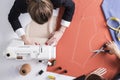 Woman is cutting while her colleague is sewing Royalty Free Stock Photo